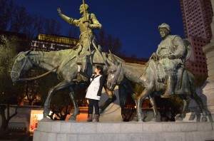 Posing with a statue of the famous Spanish character of the same title, Don Quijote de la Mancha, and Sancho Panza. 