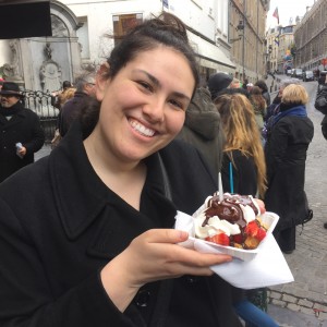 Liège waffle with whipped cream, strawberries, and chocolate sauce
